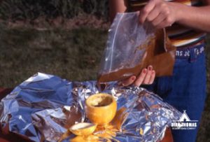 Chocolate Cake in an Orange Peel Pour chocolate cake in an orange to make a simple outdoor treat.