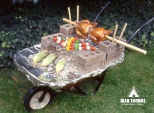 Dian gets creative cooking delicious food out of a garden wheelbarrow.