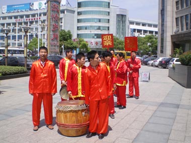 The band for the wedding processional, dressed in Chinese traditional costumes.